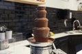 Chocolate Fountain Fontain on showcase in shop restaurant in Belgium, Brussels Royalty Free Stock Photo