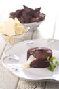 Chocolate fountain, orange cupcake. Photo of food on a white background