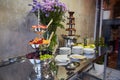 Chocolate fountain stands on a metal table, dessert - next to it are fruits and flowers, top view Royalty Free Stock Photo