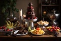 chocolate fountain surrounded by plates and skewers of fruits and cookies for a classic fondue party