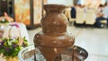 Chocolate fountain at a wedding celebration in europe. Royalty Free Stock Photo