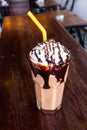 Chocolate frappÃÆÃÂ© served with whipped cream and chocolate syrup