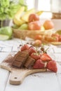 Chocolate with fresh berries on wooden table Royalty Free Stock Photo