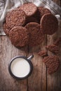 chocolate ginger cookies and milk on the table close-up. Vertical top view