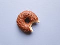 Chocolate glazed donut or doughnut with bite missing Royalty Free Stock Photo