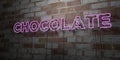 CHOCOLATE - Glowing Neon Sign on stonework wall - 3D rendered royalty free stock illustration