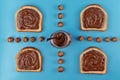 Chocolate hazelnut pasta in a jar on  a blue background Royalty Free Stock Photo