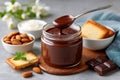 Chocolate hazelnut spread jar with dripping spoon Royalty Free Stock Photo