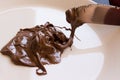 Chocolate hazelnut spread on plate  with knife. Close up Royalty Free Stock Photo