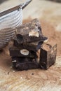 chocolate with hazelnuts broken into pieces, close up