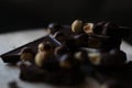 Broken pieces of black chocolate with nuts Royalty Free Stock Photo