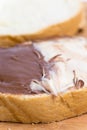 Chocolate hazelnuts cream on the bread, closeup macro image Royalty Free Stock Photo