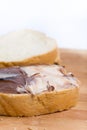 Chocolate hazelnuts cream on the bread, closeup macro image Royalty Free Stock Photo