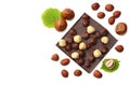 chocolate with hazelnuts and leaves isolated on white background. top view Royalty Free Stock Photo