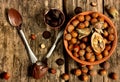 Chocolate and hazelnuts on a wooden background Royalty Free Stock Photo