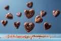 Chocolate heart cookies in motion against calming blue background