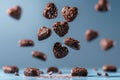 Chocolate heart cookies in motion against calming blue background