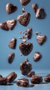 Chocolate heart cookies in motion against calming blue background