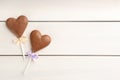 Chocolate heart shaped lollipops on white wooden table, flat lay. Space for text Royalty Free Stock Photo