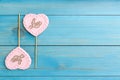 Chocolate heart shaped lollipops with word Love on turquoise wooden table, flat lay. Space for text Royalty Free Stock Photo