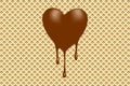 Chocolate heart on a wafer background
