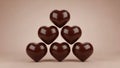 Chocolate hearts stacked in pyramid shape isolated on white background Royalty Free Stock Photo