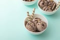 Chocolate homemade ice cream decorated with nuts, chocolate chips, wafer rolls, in white bowl. Summer cooling desserts Royalty Free Stock Photo