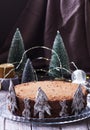 Chocolate honey cake in a Christmas decoration on a wooden background Royalty Free Stock Photo