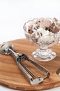 Chocolate ice cream balls served in a crystal bowl with metal se Royalty Free Stock Photo