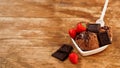 Chocolate ice cream in a bowl. Dessert decorated with chocolate and strawberries Royalty Free Stock Photo