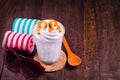 Chocolate ice cream in a cup with sunglasses and wooden spoon