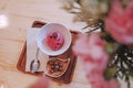Chocolate ice cream in a glass cup with flower on wood table Royalty Free Stock Photo