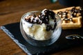 Chocolate ice cream with nuts in a glass bowl Royalty Free Stock Photo