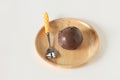 Chocolate ice cream in a wooden plate on white background Royalty Free Stock Photo