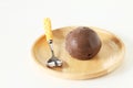 Chocolate ice cream in wooden plate on white background Royalty Free Stock Photo