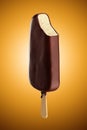 Chocolate icecream dessert on wooden stick. Royalty Free Stock Photo