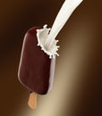 Chocolate icecream with wooden stick and milk splash