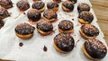 Chocolate icing donuts Sufganiyah or Sufganiyot for Jewish holiday Hanukkah or Hanuka in Hebrew. Sufganiyah - donuts in israel