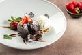 chocolate lava cake with fresh strawberries, ice-cream ball and mint, Food recipe background. Close up Royalty Free Stock Photo