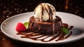 Chocolate lava cake with a scoop of vanilla ice cream on top, served with berries on a white plate, drizzled with chocolate syrup Royalty Free Stock Photo