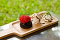 Chocolate Lava cake Served with Strawberry and Vanilla ice cream whipping cream set on wooden tray in summer time with day light. Royalty Free Stock Photo