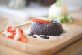 chocolate lava cake with vanilla ice cream and strawberry