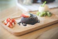 Chocolate lava cake with vanilla ice cream and strawberry