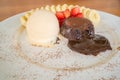 Chocolate lava cake with vanilla icecream, strawberry and banana Royalty Free Stock Photo