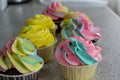 Chocolate and lemon cupcakes with colored cream