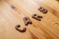 Chocolate letter cookies, written carb