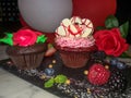 Chocolate love decorated cupcakes with hearts and balloons and roses Royalty Free Stock Photo