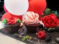 Chocolate love decorated cupcakes with hearts and balloons and roses Royalty Free Stock Photo