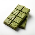 Chocolate with matcha tea craft production, green bars on white background Royalty Free Stock Photo