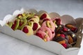 Chocolate medians with fruits and nuts Royalty Free Stock Photo
